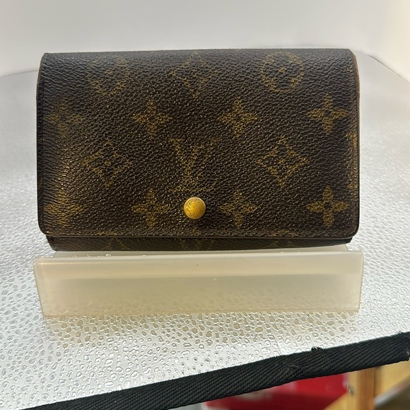 Louis Vuitton billfold. The dimensions are 6 inches wide and 4 inches. Authentic - Picture 1 of 10